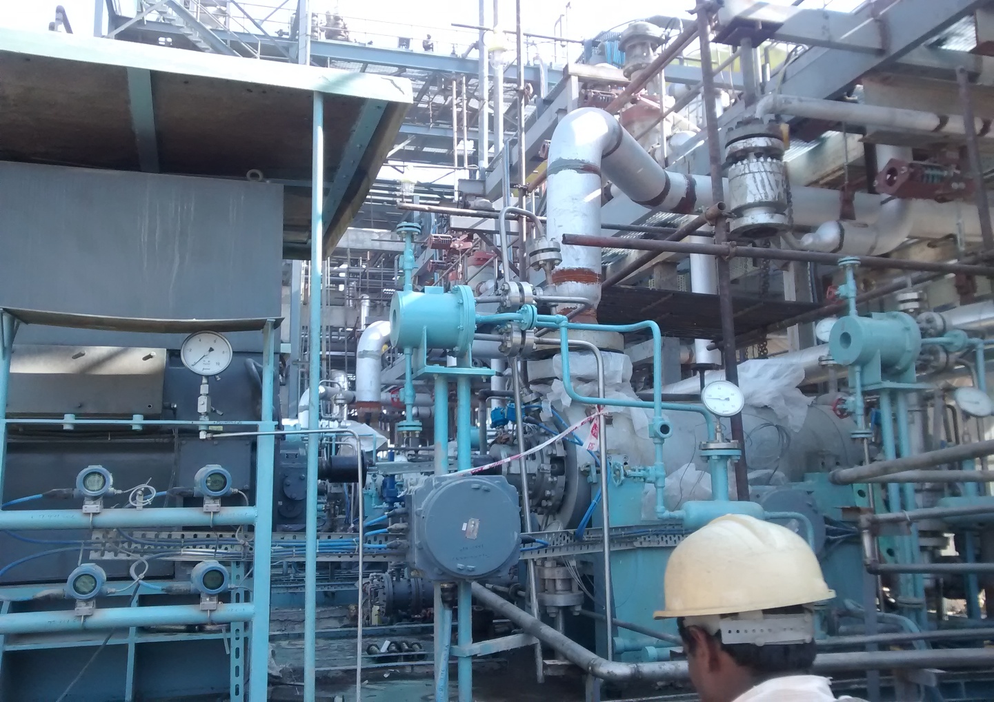Field engineer working on rotating equipment in-plant